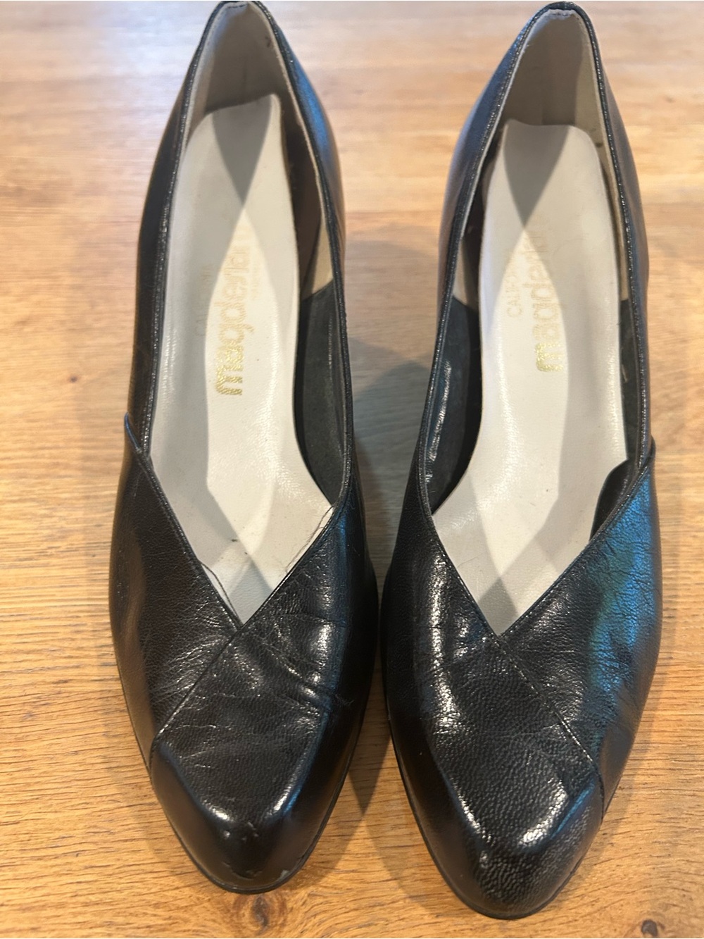 Black Leather Pointed-Toe Wedge Pumps